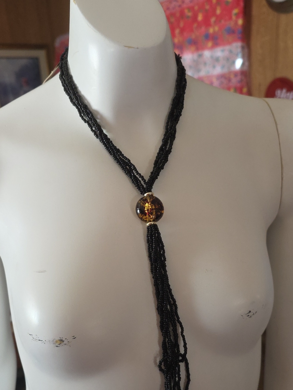 Black Beaded Lariat Necklace with Amber Accent